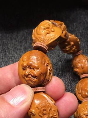 渔樵耕读 橄榄核上的诗意生活与核雕艺术